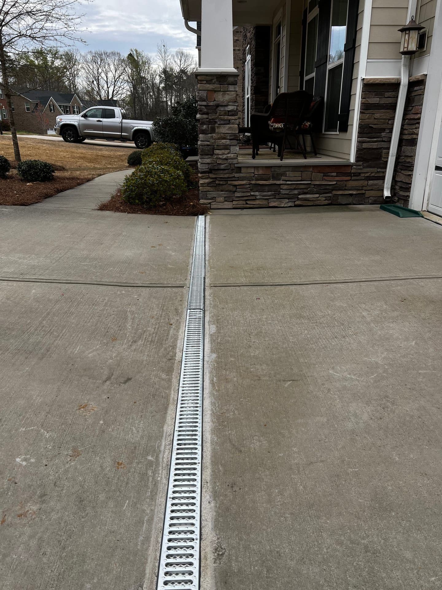 Concrete driveway drain detail in the Charlotte metro