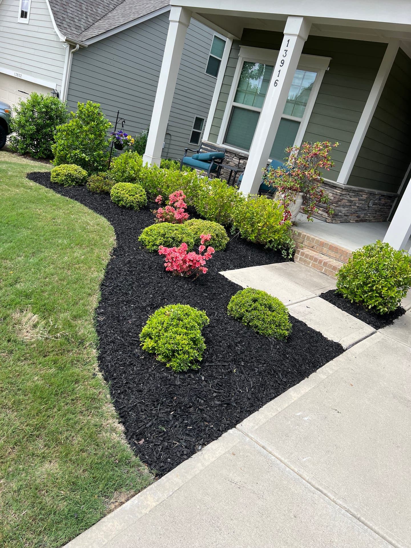 Landscaped mulch beds and shrubs in Charlotte, NC